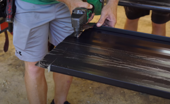 Coquitlam Roofers cutting metal roof